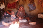 Opuwo - Himba village - Preparing the otjize paste